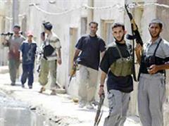 Bewaffnete Einwohner von Sadr City.